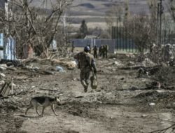 Ukraine retakes a Kyiv suburb as negotiations resume in the shadows