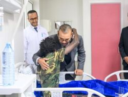 King of Morocco visits earthquake patients at Marrakech, kissing one on head and donating blood